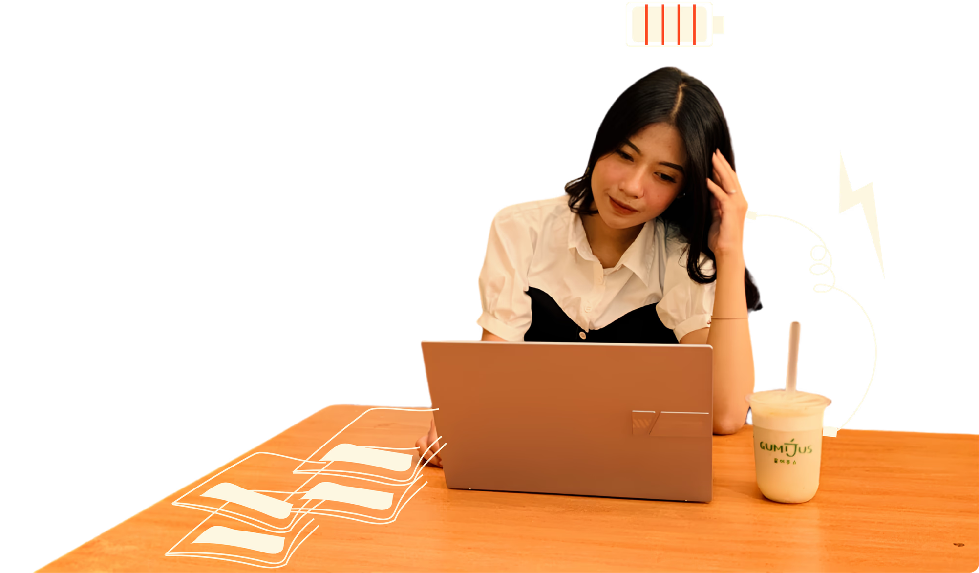 Woman working with a laptop and Gumijus drink